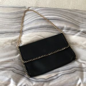 Faux leather black purse with gold chain